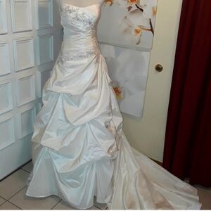 Wedding dress is not pure white...it's a little off-white